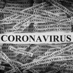 Strips of newspaper with the word Coronavirus typed on them
